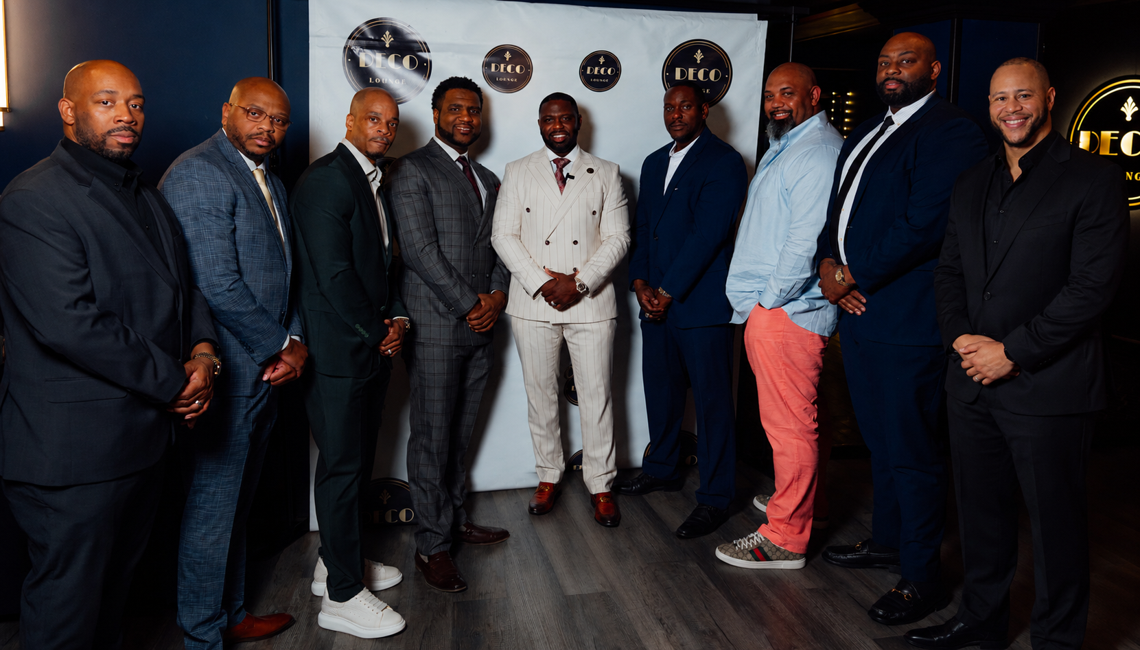 The nine members of Upstate Collective Inc. gathered at Deco Lounge in Buffalo, NY